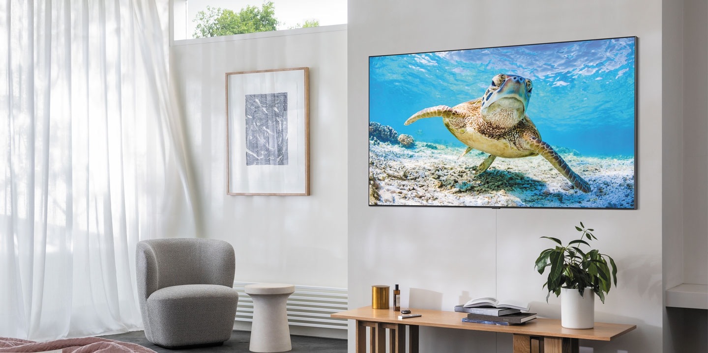 Samsung QLED TV wall mounted in living room