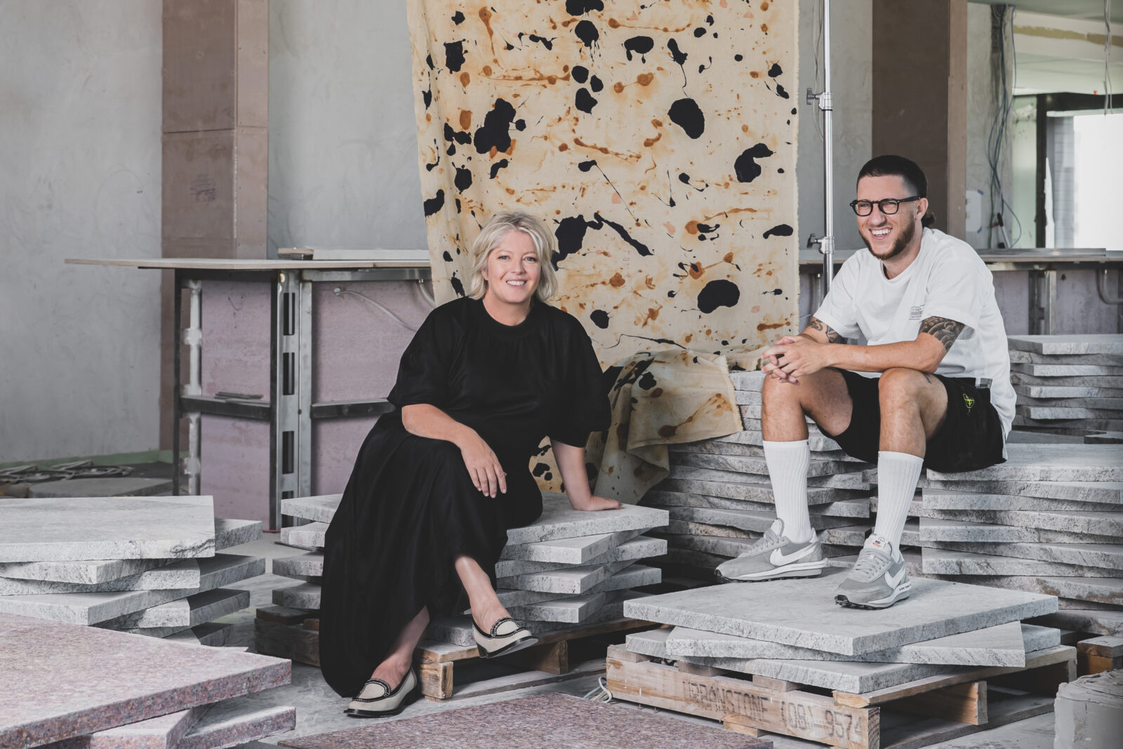 Ace Hotel dining and design team sitting on granite blocks
