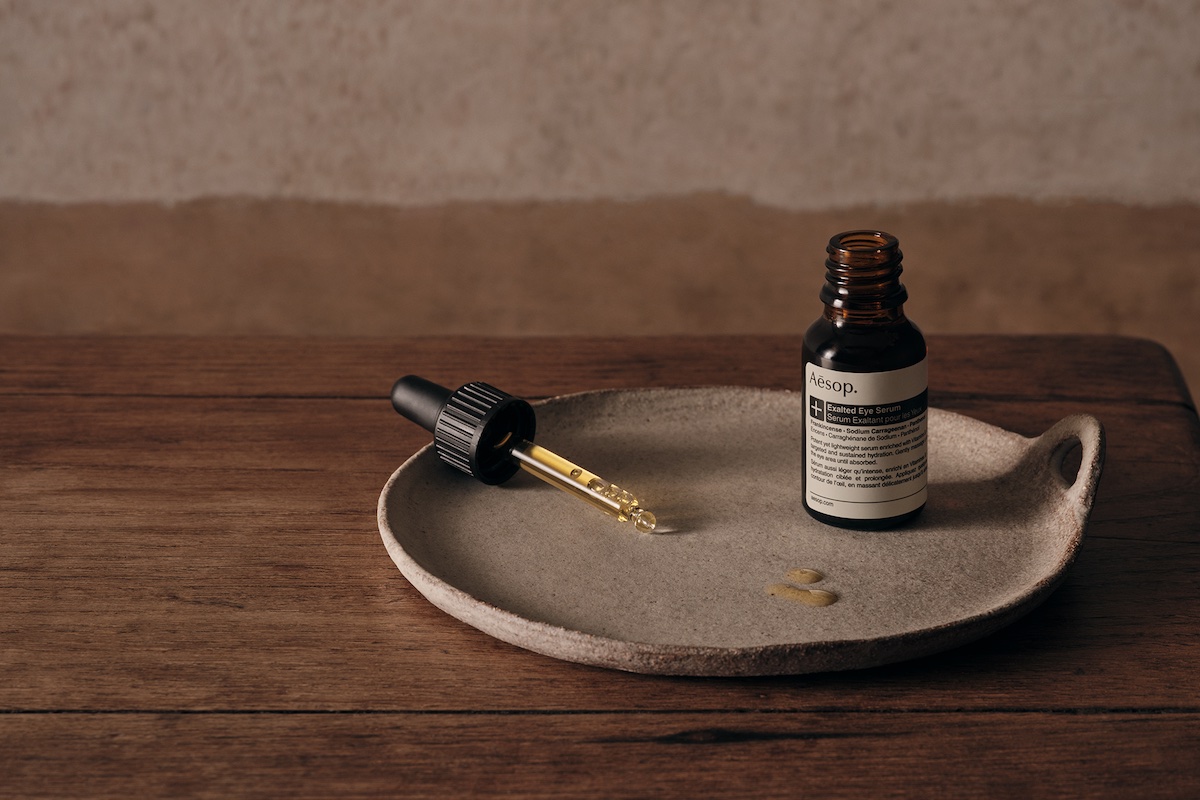 Aesop Exalted Eye Serum tool on a stone plate